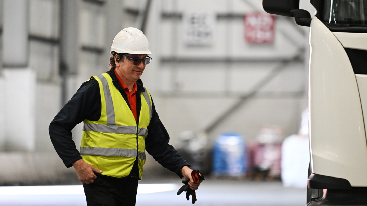 Image of a man walking to his lorry